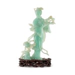 A jadeite figure of a female immortal, 20th century 二十世紀 翠玉仙女獻壽立像