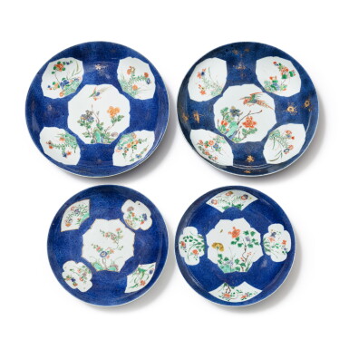 View full screen - View 1 of Lot 159. A group of four powder-blue ground famille verte dishes Qing dynasty, Kangxi period | 清康熙 灑藍地描金開光五彩花卉紋盤四件.