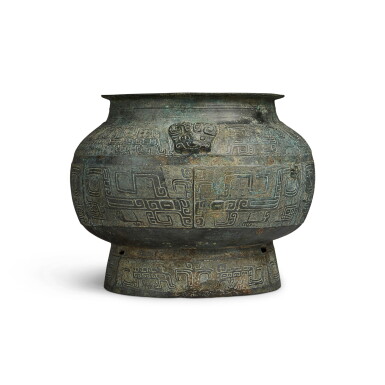 View full screen - View 1 of Lot 34. An archaic bronze ritual vessel (Pou), Late Shang dynasty | 商末 青銅饕餮紋羊首瓿.
