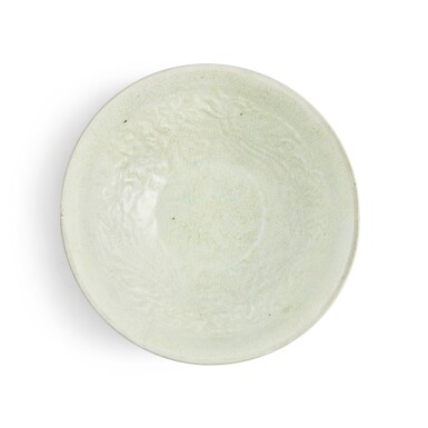 View full screen - View 1 of Lot 17. A molded Qingbai 'phoenix and flower' bowl, Yuan dynasty.