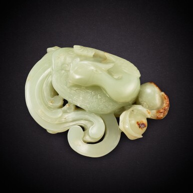 View full screen - View 1 of Lot 6879. A white and russet jade 'phoenix and peach' group, Qing dynasty, 18th century | 清十八世紀 白玉瑞鳳蟠桃.