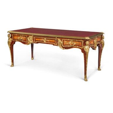 View full screen - View 1 of Lot 33. A Régence Style Gilt-Bronze Mounted Amaranth and Bois Satiné Bureau Plat, after the Model by Charles Cressent, Late 19th Century.