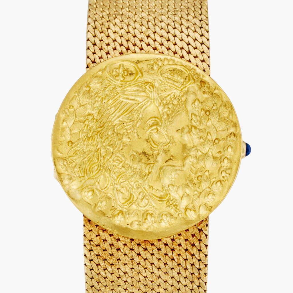View full screen - View 1 of Lot 128. Reference 9167 B 14 Dali d'Or | A limited edition yellow gold coin concealed dial bracelet watch, Circa 1969.