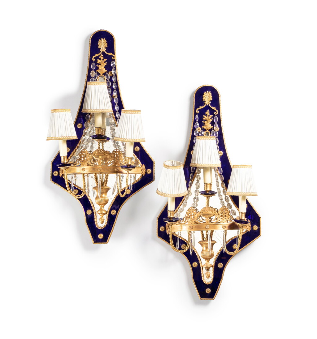 View full screen - View 1 of Lot 237. A pair of gilt-metal cut-glass and giltwood three-light wall lights, Louis XVI, circa 1780 Paire d’appliques à trois lumières en métal doré, verre et bois doré, d’époque Louis XVI, vers 1780.