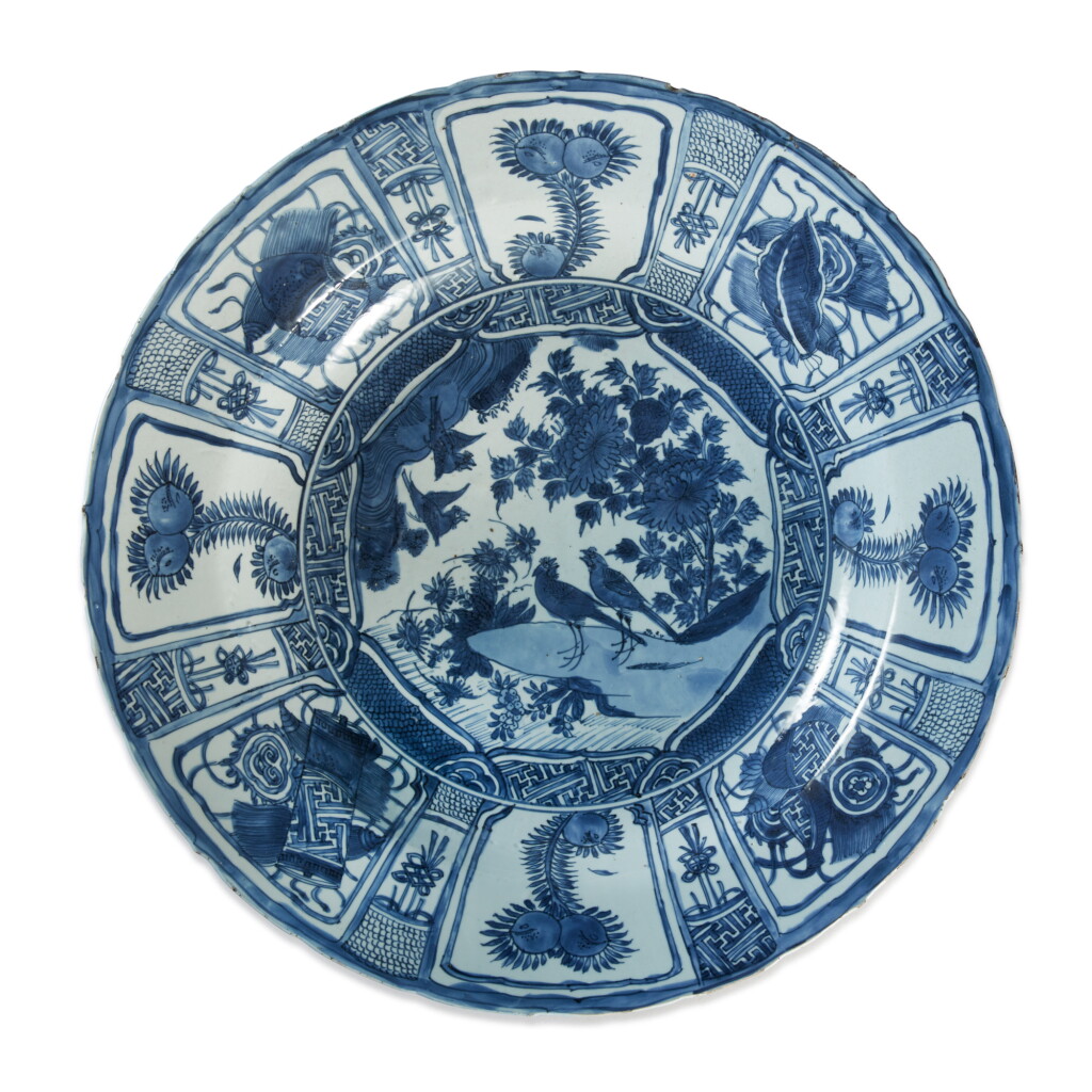 View full screen - View 1 of Lot 995. A LARGE BLUE AND WHITE BARBED-RIM 'BIRDS IN ROCKERY' KRAAK DISH, LATE MING DYNASTY.