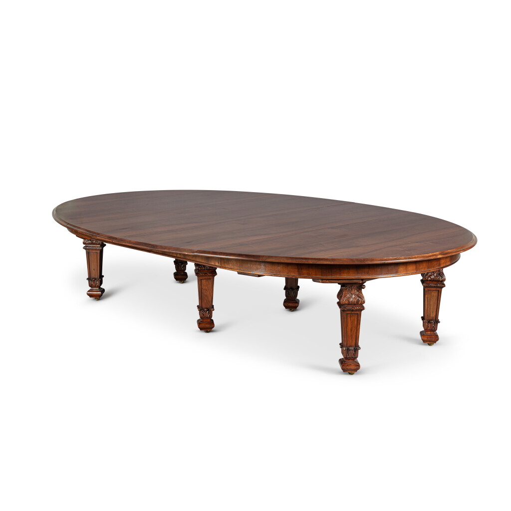 View full screen - View 1 of Lot 550. An English walnut extending dining table, by White, Allom and Company, early 20th century.