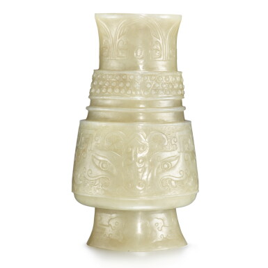 View full screen - View 1 of Lot 26. An archaistic beige-celadon jade vase, Qing dynasty, 19th century | 清十九世紀 青玉雕仿古饕餮紋觶.