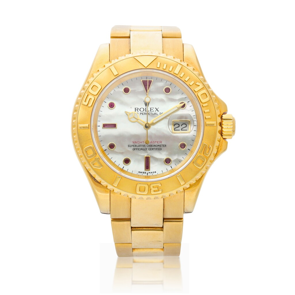 View full screen - View 1 of Lot 8019. Yacht-Master, Reference 16628B, A yellow gold and ruby-set wristwatch with date, mother-of-pearl dial and bracelet, Circa 2004 | 勞力士 Yacht-Master 型號16628B 黃金鑲紅寶石鏈帶腕錶,備日期顯示及珠母貝錶盤,約2004年製.