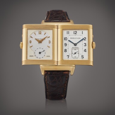 View full screen - View 1 of Lot 425. Reference 270.154 Reverso Duoface | A yellow gold rectangular dual time wristwatch with day/night indication, Circa 2000.