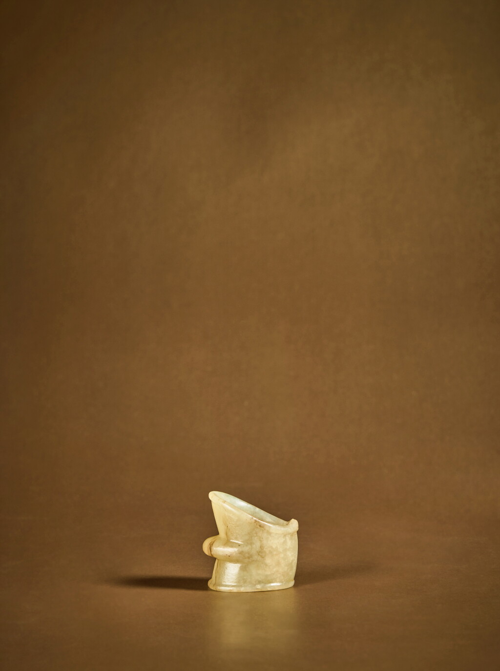 View full screen - View 1 of Lot 126. A yellow jade archer's ring, Song dynasty .