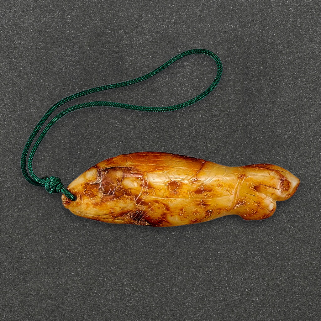 View full screen - View 1 of Lot 2016. A russet jade figure of a fish, Ming dynasty or earlier 明或更早 玉雕魚.