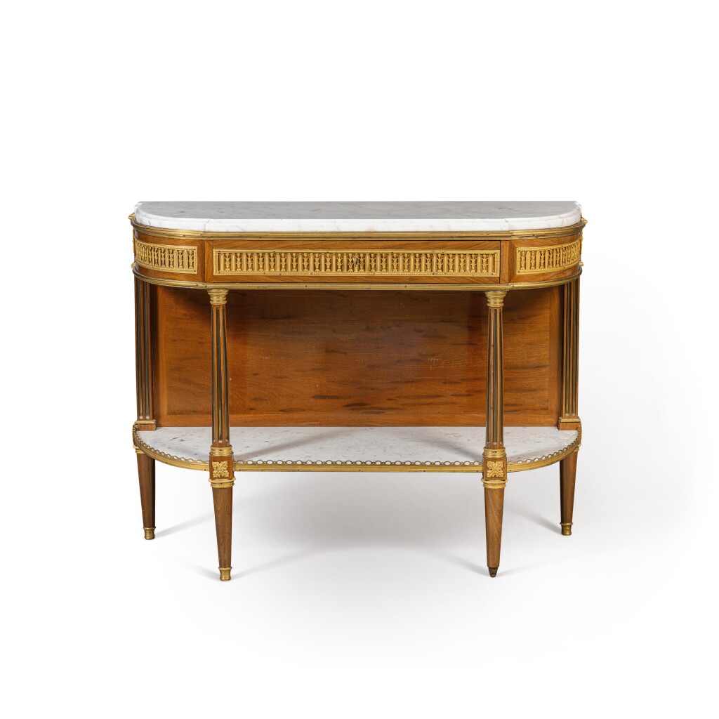 View full screen - View 1 of Lot 239. A Louis XVI gilt-bronze mounted mahogany and mahogany veneered console, circa 1785, attributed to Caspar Schneider.