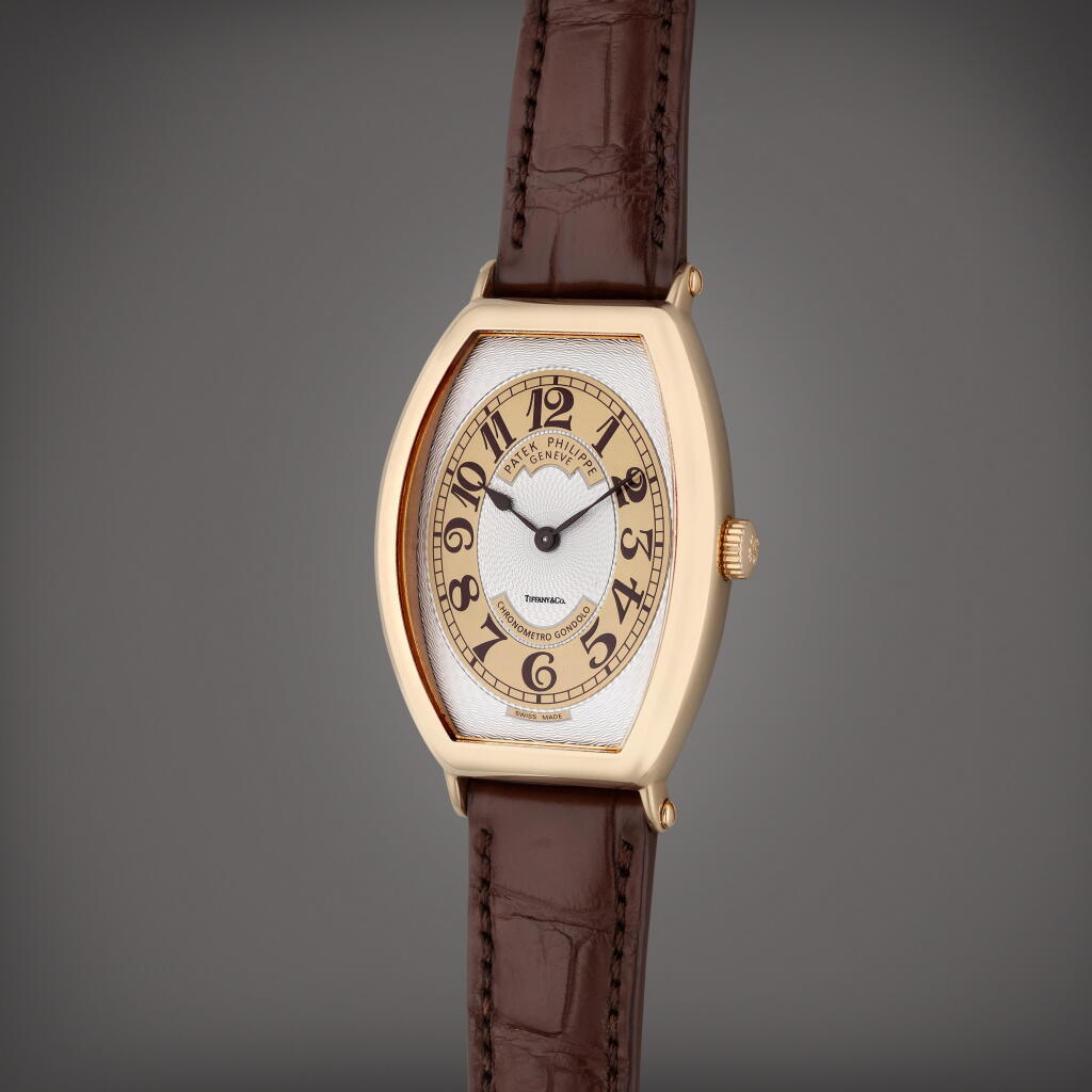 View full screen - View 1 of Lot 485. Reference 5098R Chronometro Gondolo | Retailed by Tiffany & Co.: A pink gold tonneau shaped wristwatch, Circa 2008.