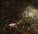 PHILIPS WOUWERMAN | A grotto with travellers unloading a wagon, a gypsy fortune-teller, a blacksmith and other figures