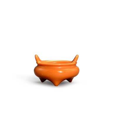 View full screen - View 1 of Lot 5616. A realgar-imitation orange glass tripod incense burner, Mark and period of Jiaqing | 清嘉慶 仿雄黃料雙橋耳三足爐 《嘉慶年製》款.