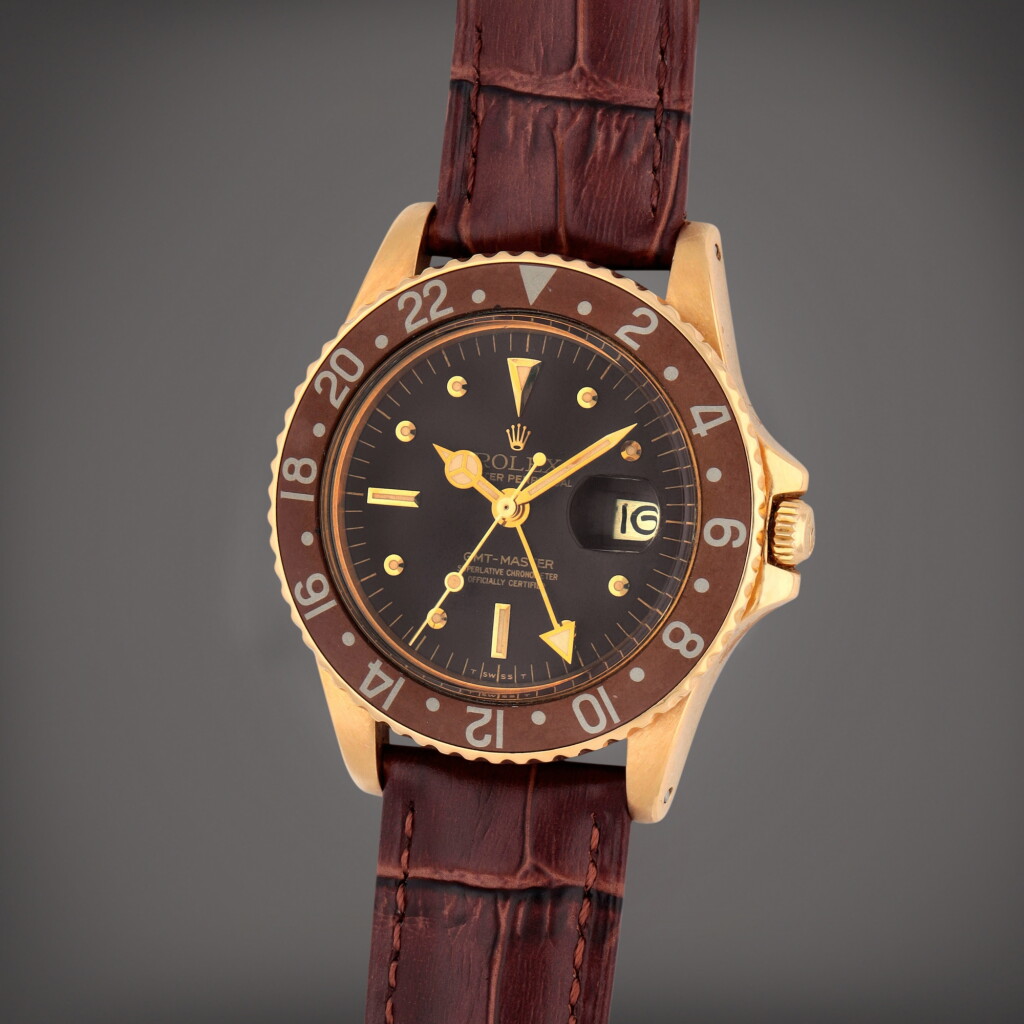 View full screen - View 1 of Lot 277. GMT-Master 'Nipple Dial', Reference 1675 | A yellow gold dual time zone wristwatch with date | Circa 1978.