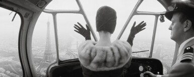 View full screen - View 1 of Lot 89. NORMAN PARKINSON | CARDIN HAT OVER PARIS, 1960.