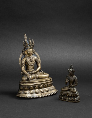 View full screen - View 1 of Lot 32. Figure de Bouddha en alliage de cuivre partiellement doré, et, figure de Bouddha en bronze Tibet, probablement XIIIE siècle et Dynastie Qing, XVIIIE siècle | 西藏 或十三世紀 局部鎏金銅合金佛坐像 及 清十八世紀 銅佛坐像 | A copper-alloy figure of Buddha, Tibet, possibly 13th century, and a bronze figure of Buddha, Qing Dynasty, 18th century.