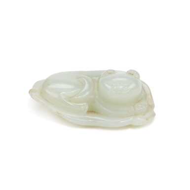 View full screen - View 1 of Lot 266. A small pale celadon jade figure of a cat, Qing dynasty, early 19th century | 清十九世紀初 青白玉臥獾.