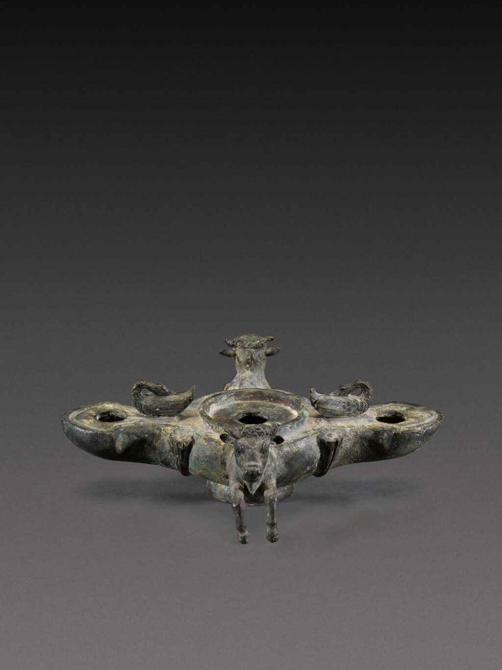 View full screen - View 1 of Lot 103. A Roman Bronze Oil Lamp, 1st Century A.D..