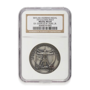 View full screen - View 1 of Lot 215. FLOWN ON SKYLAB II (SL-3). APOLLO ASTRONAUT CHARLES DUKE'S SKYLAB II SILVER ROBBINS MEDALLION.