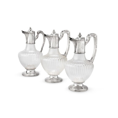 View full screen - View 1 of Lot 373. A set of three silver-mounted glass covered ewers in the Louis XVI style, Alphonse Debain, Paris, circa 1900 | Ensemble de trois aiguières couvertes de style Louis XVI en verre monté en argent par Alphonse Debain, Paris, vers 1900.
