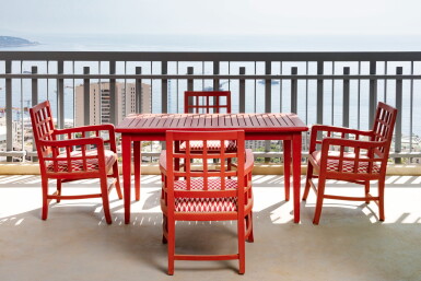 View full screen - View 1 of Lot 1137. Attributed to Tectona House Suite of four armschairs and a teck table lacquered in red | Attribué à la maison Tectona Suite de quatre fauteuils et une table en teck laqué rouge.