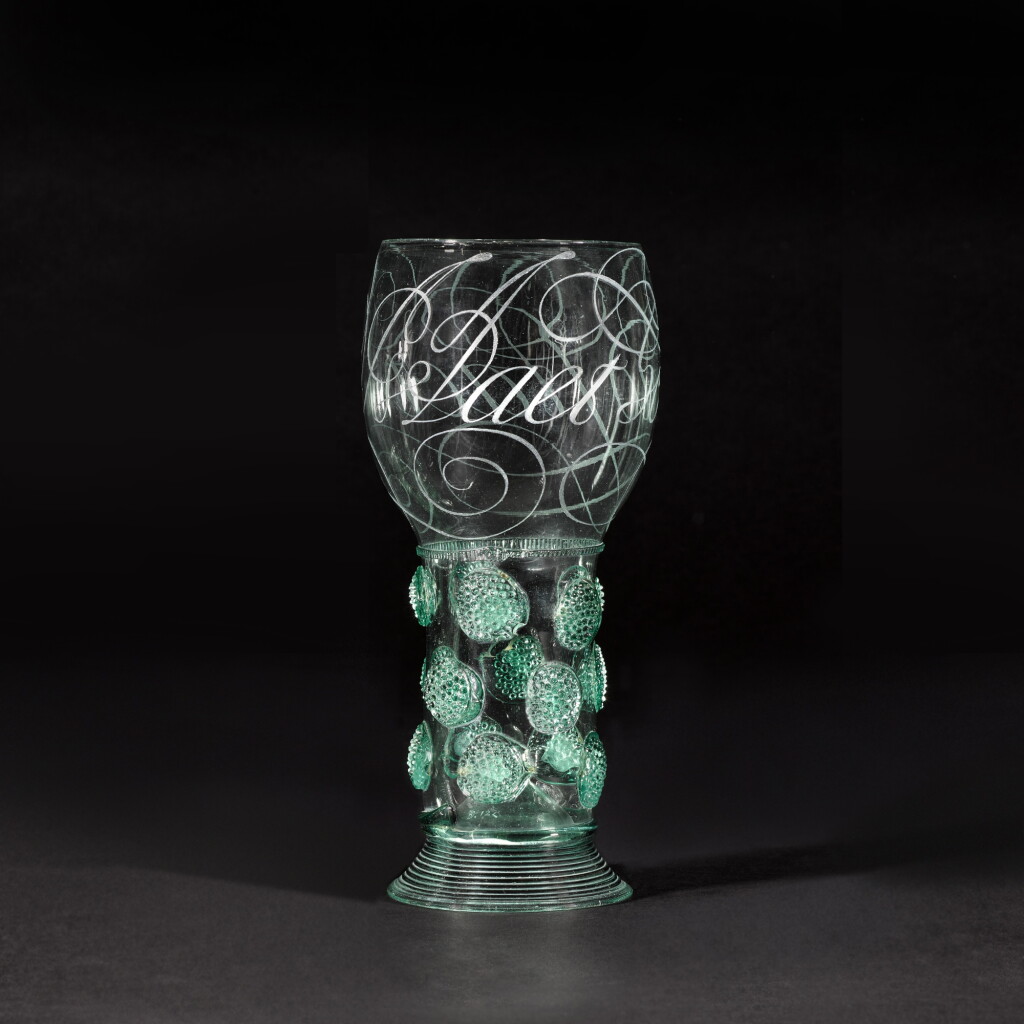 View full screen - View 1 of Lot 1. An important Dutch diamond-point engraved calligraphic green glass roemer, 17th century.