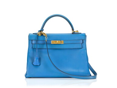 View full screen - View 1 of Lot 16. KELLY 32 RETOURNE BLUE FRANCE COLOUR IN COURCHEVEL LEATHER WITH GOLD HARDWARE. HERMÈS, 1992 .