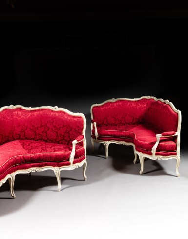 View full screen - View 1 of Lot 103. A pair of Louis XV grey painted wood corner sofas, circa 1760, stamped by Nicolas Heurtaut.