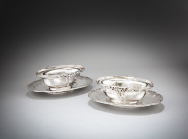 View full screen - View 1 of Lot 420. Two silver sauceboats and their stands, Jacques-Nicolas Roëttiers, Paris, 1775-1776 | Deux saucières et leurs présentoirs formant paire en argent par Jacques-Nicolas Roëttiers, Paris, 1775-1776.