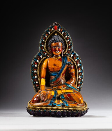 View full screen - View 1 of Lot 56. An amber, paste and shell inlaid gilt-copper figure of Ratnasambhava, Nepal, 19th century | 尼泊爾 十九世紀 銅鎏金嵌寶及琥珀寶生佛坐像.