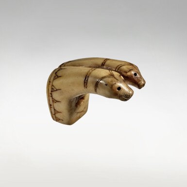 View full screen - View 1 of Lot 716. Inupiaq Toggle with Two Zoomorphic Heads.