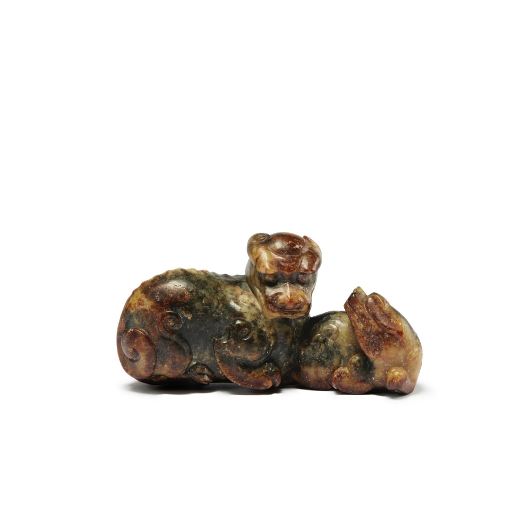 View full screen - View 1 of Lot 128. A brown jade 'mythical beast' group, Qing dynasty, 19th century.