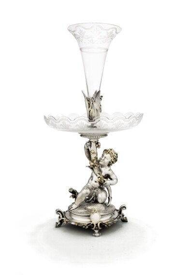 View full screen - View 1 of Lot 16. A SILVER-PLATED BRONZE AND ENGRAVED CRYSTAL CENTREPIECE, CHRISTOFLE, PARIS, 1872/1873 | CENTRE DE TABLE PORTE-CORNET À L'ENFANT "BOURET" EN BRONZE ARGENTÉ ET CRISTAL GRAVÉ PAR CHRISTOFLE, PARIS, 1872-1873.