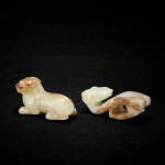 A pale celadon jade archaistic 'dragon' belt hook and a yellowish-celadon jade mythical beast, Late Ming - early Qing dynasty 明末清初 青白玉仿古龍首帶鉤一件 及 青黃玉瑞獸一件