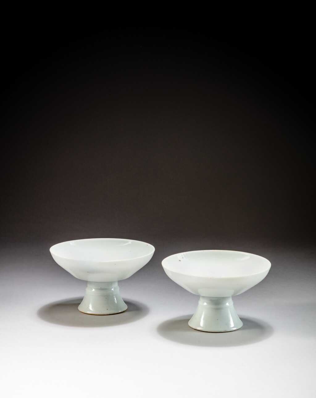 View full screen - View 1 of Lot 33. Two white-glazed stembowls, Early Qing dynasty, possibly Dehua | 清初 白釉高足盌一組兩件.