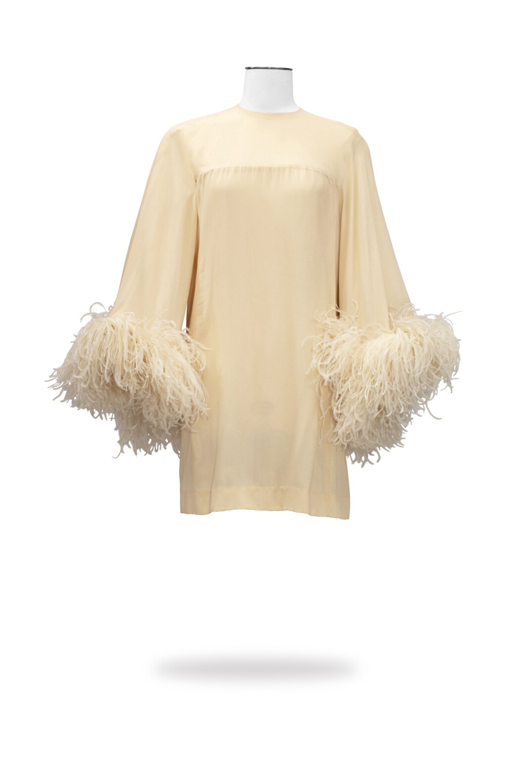 View full screen - View 1 of Lot 61. Capucci, Haute Couture, circa 1964, Muslin cape dress with ostrich feathers | Robe cape courte en mousseline et poignets garnis de plumes.