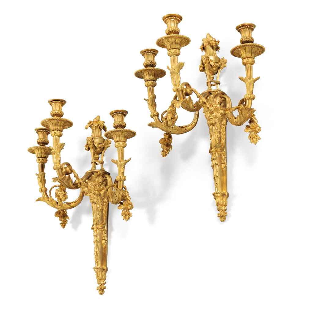 View full screen - View 1 of Lot 158. A pair of Louis XVI style gilt-bronze wall appliques, in the taste of Jean-Charles Delafosse | Paire d'appliques en bronze doré de style Louis XVI dans le style de Jean-Charles Delafosse.