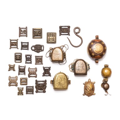 View full screen - View 1 of Lot 50. A study collection of 'Gau' reliquary boxes and buckles, Tibet and other Himalayan regions, 11th/17th century | 西藏及喜馬拉雅其他地區 十一至十七世紀 嘎烏盒及帶扣一組二十六件.