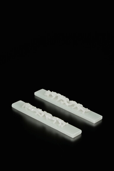 View full screen - View 1 of Lot 438. A pair of white jade 'chilong' scroll weights, Qing dynasty, Qianlong period | 清乾隆 白玉雕螭龍紋鎮尺一對.