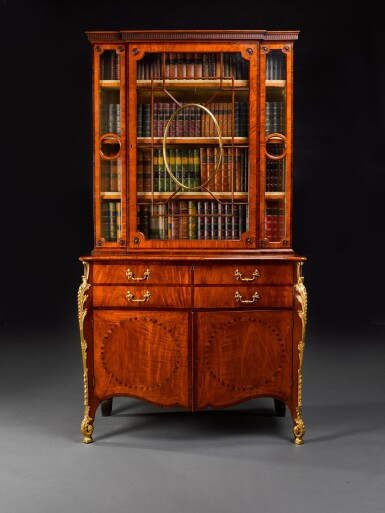 View full screen - View 1 of Lot 22. A George III gilt-brass-mounted inlaid and kingwood banded fustic secretaire cabinet , circa 1775, attributed to Thomas Chippendale.