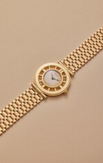 Helm | New York retailed: A rare yellow gold wristwatch in the form of a ship’s wheel with yellow gold bracelet and deployant buckle, Circa 1946