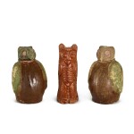 A pair of brown and green-glazed 'owl' jars and covers, and a brown-glazed pottery figure of an owl Han dynasty | 漢 鴟鴞形帶蓋陶罐一對 及 褐釉貓頭鷹
