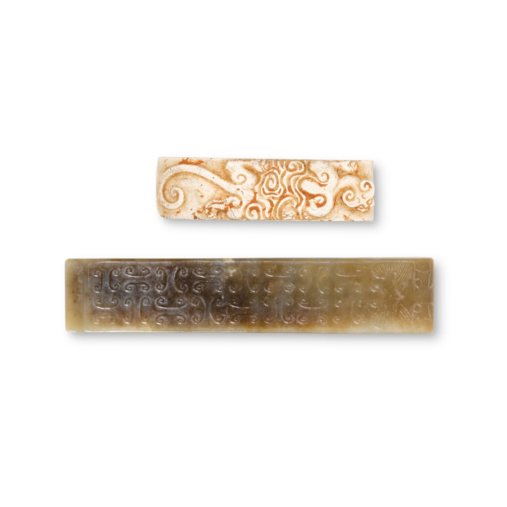 View full screen - View 1 of Lot 1. Two archaic jade sword scabbard slides, Eastern Zhou dynasty, Warring States period / Han dynasty | 東周戰國 / 漢 玉劍璏一組兩件.