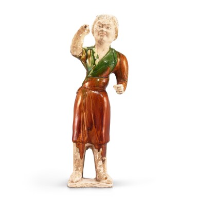 View full screen - View 1 of Lot 310. A sancai figure of a groom, Tang dynasty 唐 三彩馬伕立俑.