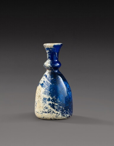 View full screen - View 1 of Lot 288. A Byzantine or Islamic Blue Glass Bottle, circa 7th-10th Century A.D. .