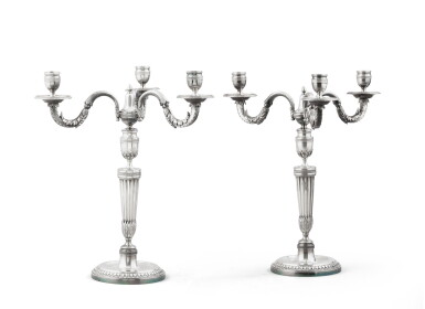 View full screen - View 1 of Lot 100. A pair of French silver three-light candelabra, Jean-Baptiste Potot, Paris, 1798-1809 | Paire de chandeliers à trois lumières en argent par Jean-Baptiste Potot, Paris, 1798-1809.