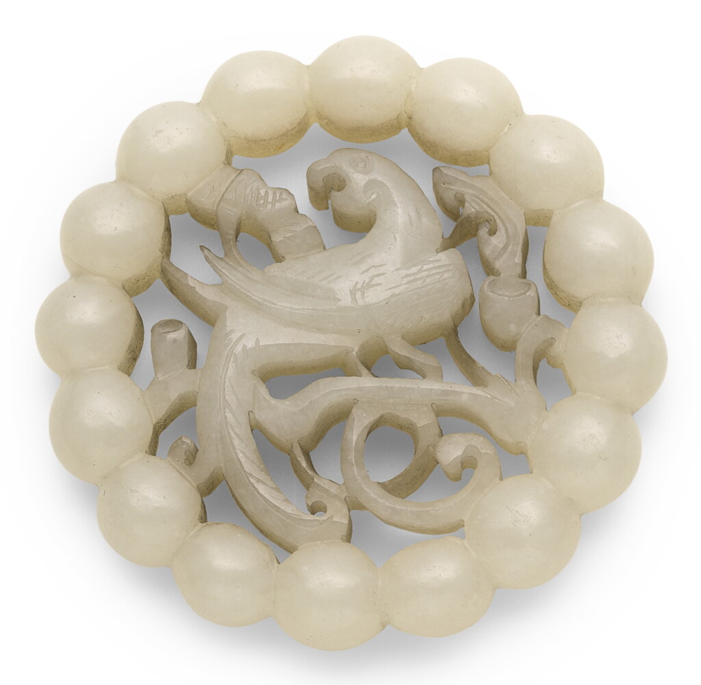 View full screen - View 1 of Lot 367. A PALE CELADON JADE RETICULATED PENDANT QING DYNASTY, 19TH CENTURY | 清十九世紀 青白玉鏤雕錦雞仙芝紋珮.