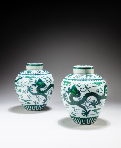 View full screen - View 1 of Lot 125. A pair of green-enameled 'dragon' jars and covers, Marks and period of Qianlong | 清乾隆 綠彩雲龍趕珠紋蓋罐一對 《大清乾隆年製》款.